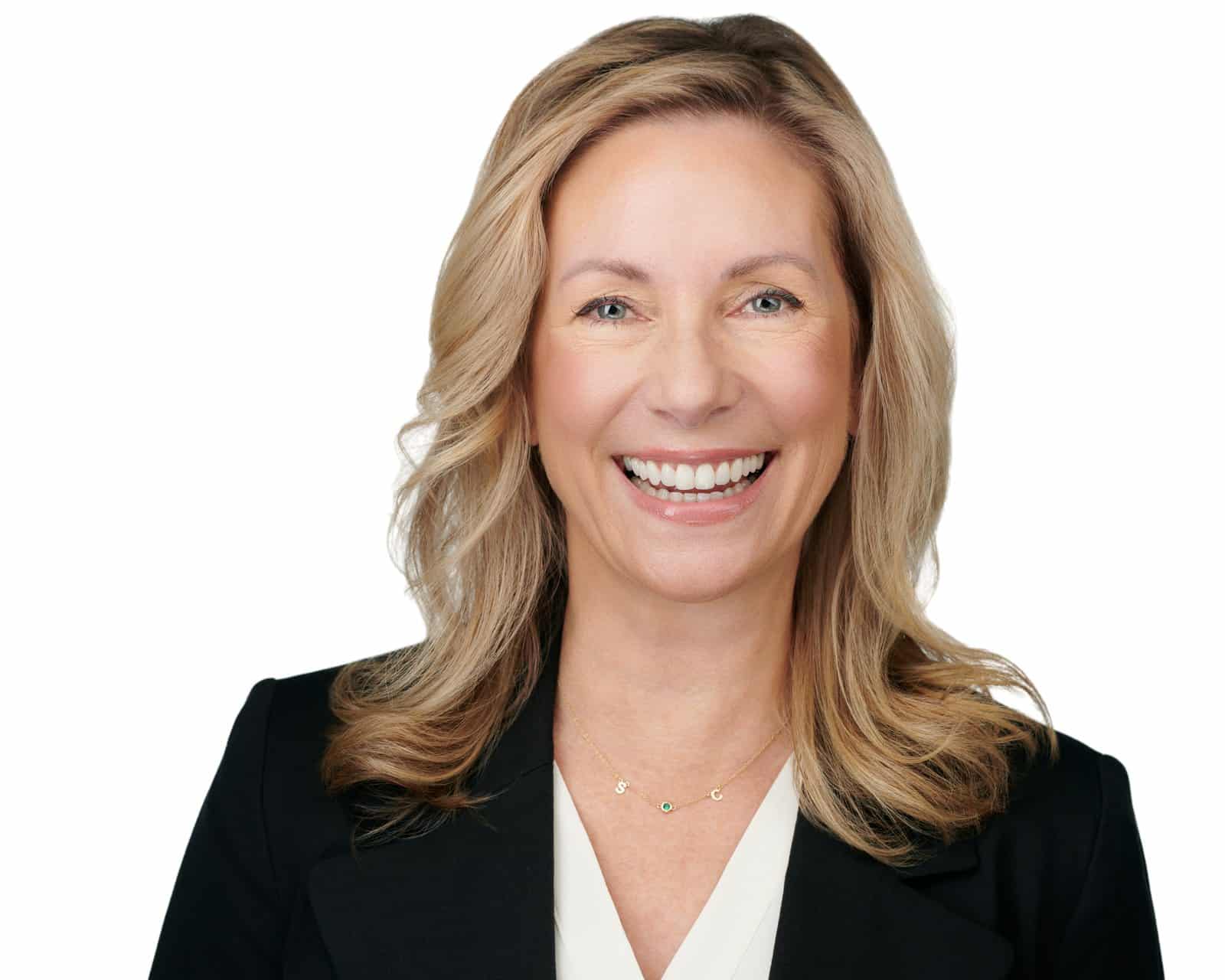 Dr. Stephanie Moore in a black blazer against a plain background