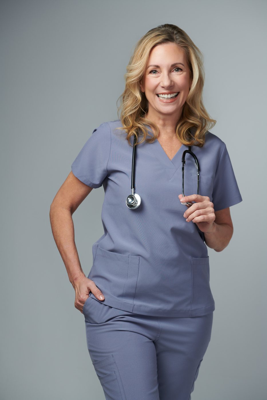 Dr. Stephanie Moore in scrubs, three-quarter portrait